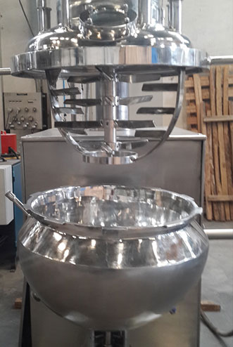 Contra rotary mixer with lid lifting arrangement. 